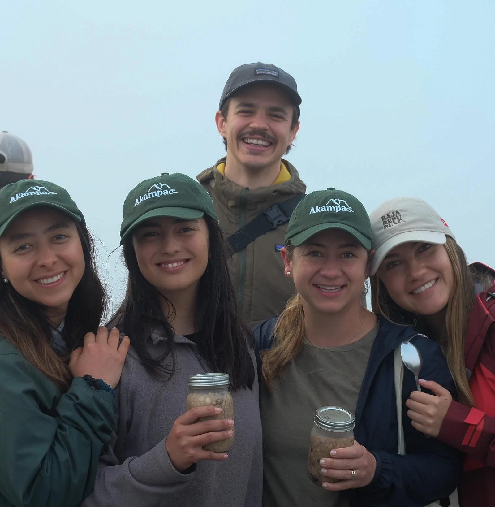 Group of young travelers together at the camp at the end of the day