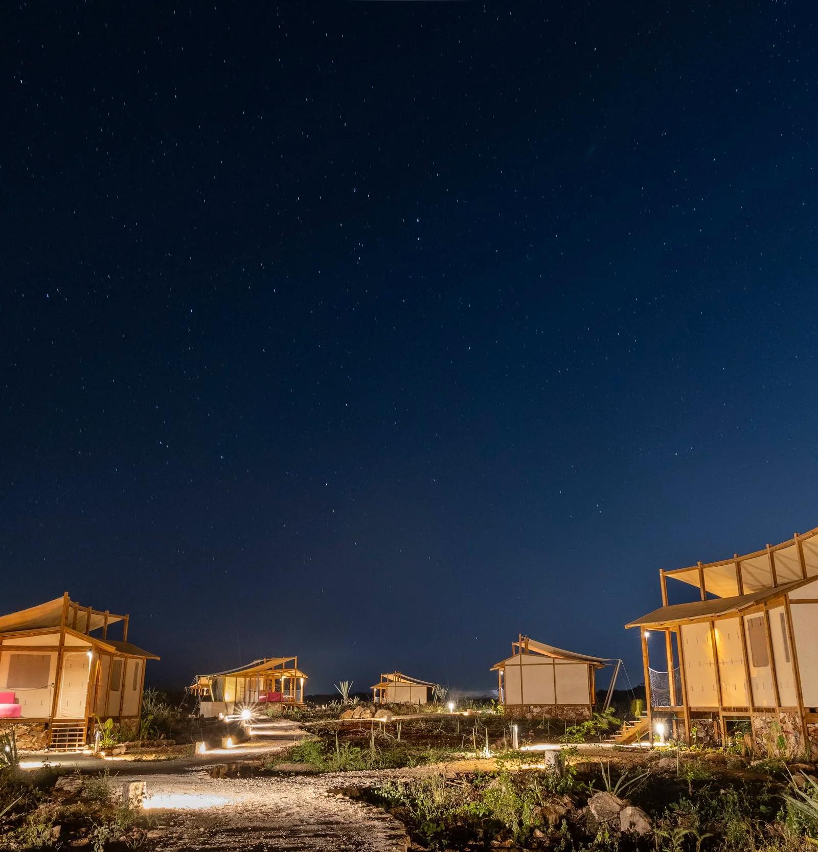 Akampa camp lit up under a starry sky in Baja California Sur